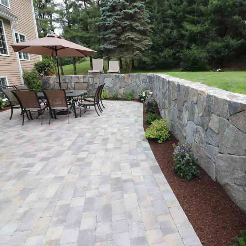 patio with landscape and retaining wall