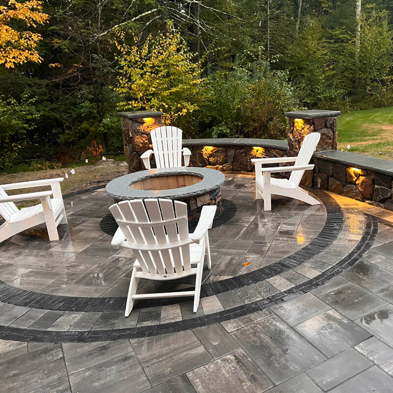 fire pit with lighted retaining wall