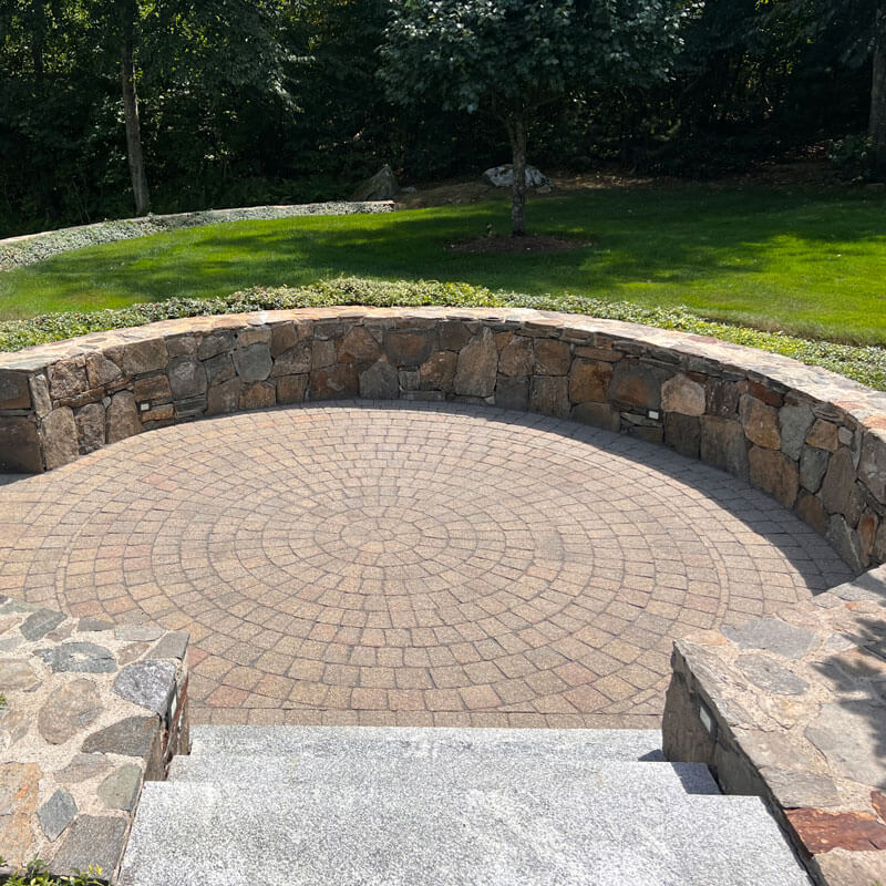 circular retaining wall with steps leading down